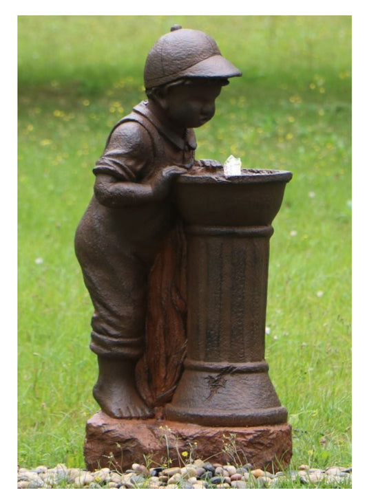 Boy Leaning Over Water Fountain with LED Light