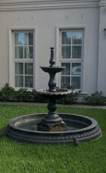 A multi-tiered water fountain with several levels